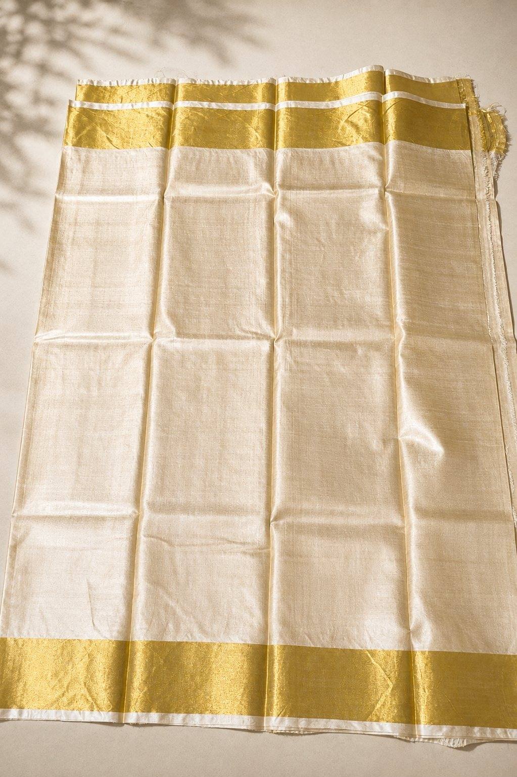 Pure Bhagalpuri Tussar Silk in natural ivory with a woven gold zari border